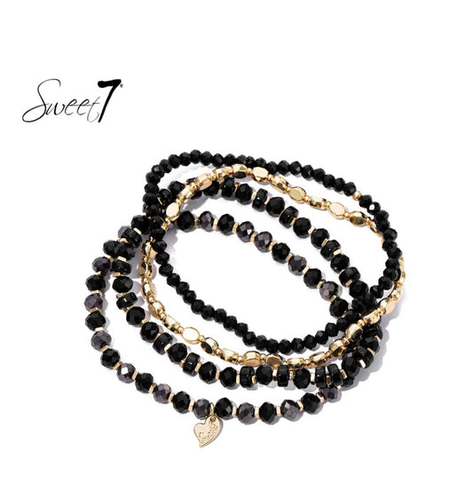 Bold & Chic – Zwarte Armbandenset met Goudaccenten