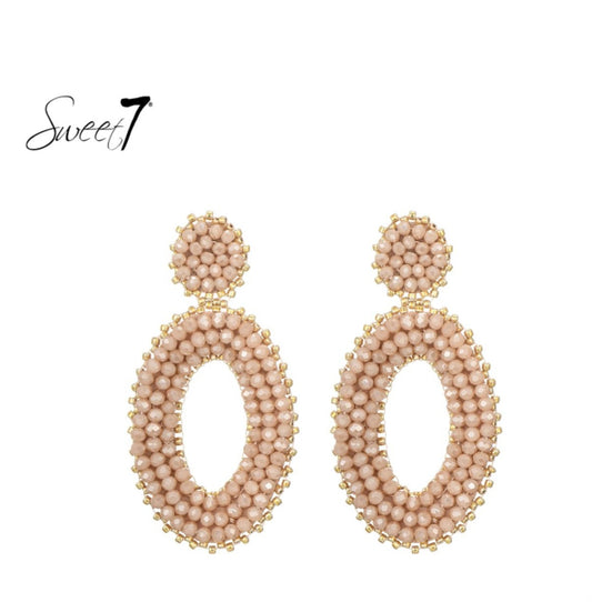 Elegante Statement Oorbellen – Ovaal Design met Nude Kralen