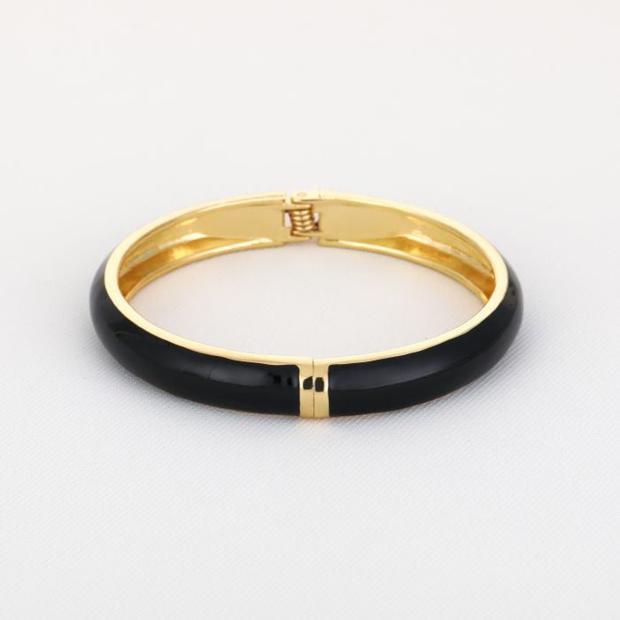 Goudkleurige stainless steel bangle met zwarte afwerking